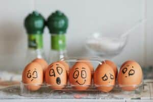 Eggs with faces painted on. No business decision is based purely on logic