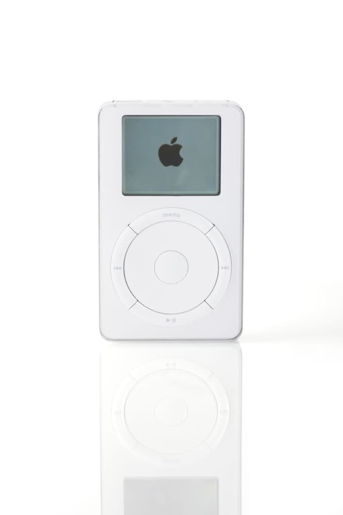First Generation iPod (Scroll wheel) with Apple logo on screen, from Apple Inc. USA. Introduced by Apple in October 2001.