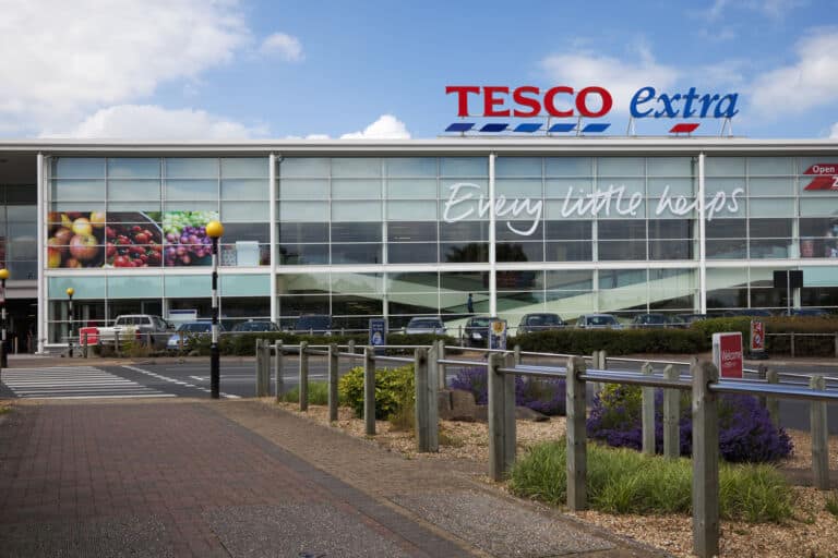 Tesco Supermarket sign, logo and slogan on the store in Altrincham, Cheshire, UK. Tesco is a multinational retailer of groceries and general goods, and is based in the UK. They are the second-largest retailer in the world measured by profits. Tesco Extra stores are larger hypermarkets selling a wide range of goods.